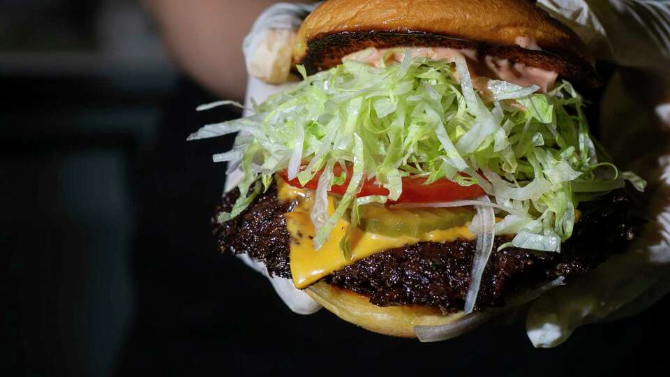 The OG Burger as seen during a Smish Smash pop-up event at Neptune's on Saturday, Oct. 24, 2020 in Alameda, Calif. Smish Smash has been slinging burgers since May and is inspired by the trend in Los Angeles and loads its shatteringly crispy patties with unusual toppings like uni.