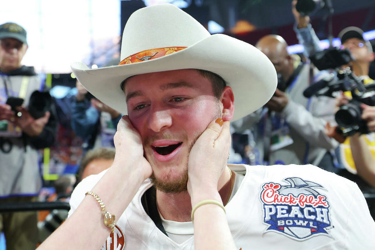 ATLANTA, GEORGIA - JANUARY 01: Quinn Ewers #3 of the Texas Longhorns celebrates after defeating the Arizona State Sun Devils 39-31 during the second overtime in the Chick-fil-A Peach Bowl at Mercedes-Benz Stadium on January 01, 2025 in Atlanta, Georgia. (Photo by Kevin C. Cox/Getty Images)