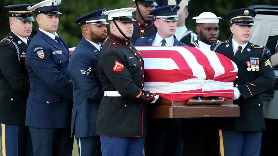 The flag-draped casket of former President Jimmy Carter is carried into Maranatha Baptist Church for a funeral service, Thursday, Jan. 9, 2025, in Plains, Ga.