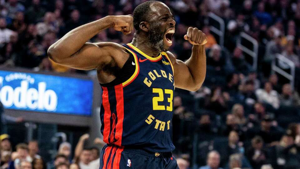 Golden State Warriors forward Draymond Green (23) reacts after fouled during scoring in the first half of his NBA basketball game against the Miami Heatin San Francisco, Tuesday, Jan. 7, 2025.