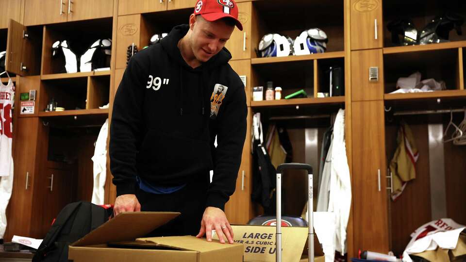 San Francisco 49ers’ Christian McCaffrey works on cleaning out his locker at Levi’s Stadium in Santa Clara, Calif., on Monday, January 6, 2025.