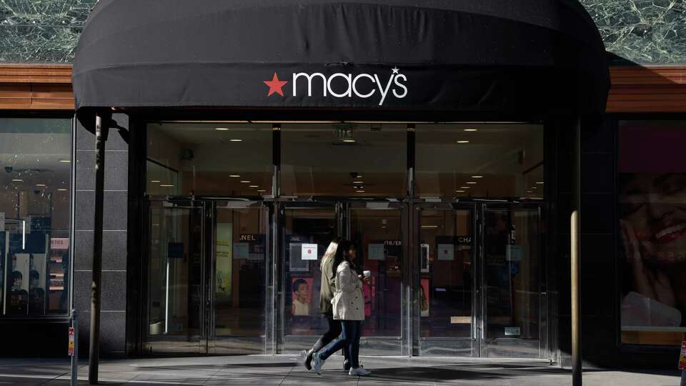 Pedestrians walk under a Macy’s awning on Wednesday, February 28, 2024 in San Francisco, Calif. Macy’’s announced Tuesday, it will close it’s flagship store in Union Square, one of 150 “underproductive” stores across the country that are planned for closure.