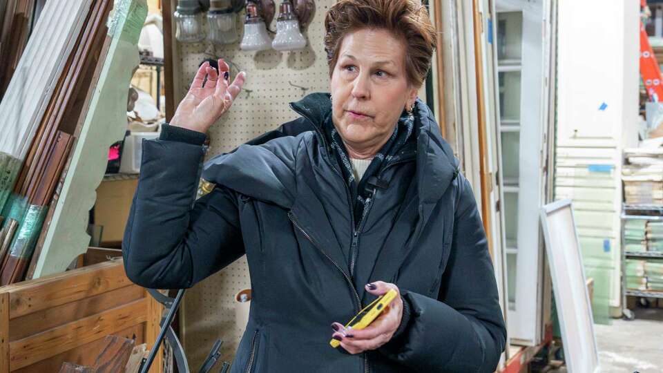 Historic Houston Executive Director Lynn Edmundson describes the items for sale inside and outside the near football field sized Historic Houston Salvage Warehouse Thursday, Jan. 9, 2024.