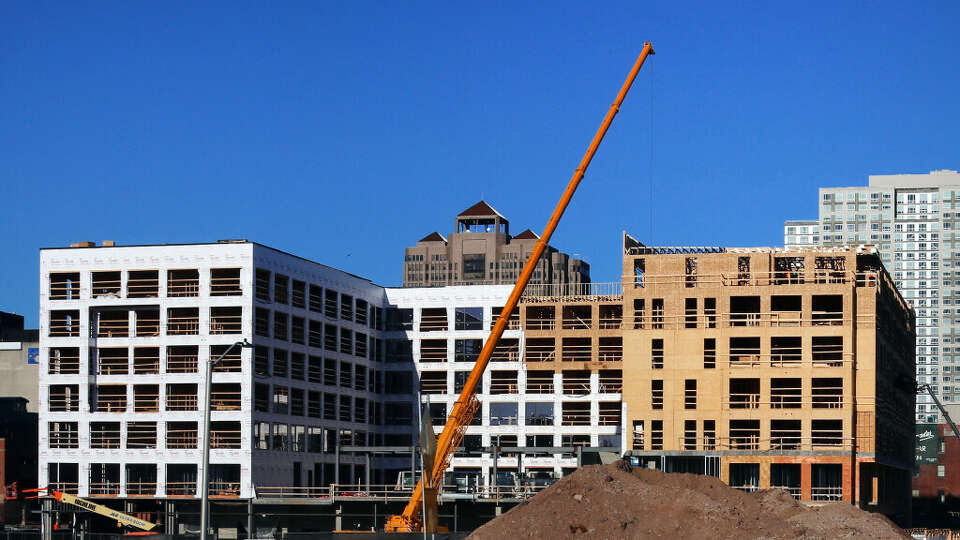 Construction continues for a new housing developments in downtown New Haven in 2023. During his annual State of the State address on Wednesday, Gov. Ned Lamont challenged the state's cities to grow by 50%. 