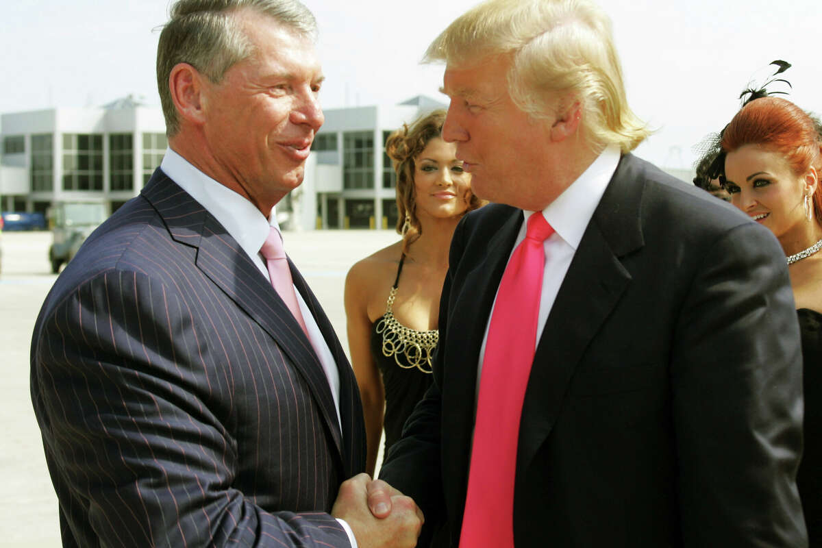 Vince McMahon left and Donald Trump attend a press conference about the WWE at the Austin Straubel International Airport on June 22, 2009 in Green Bay, Wis