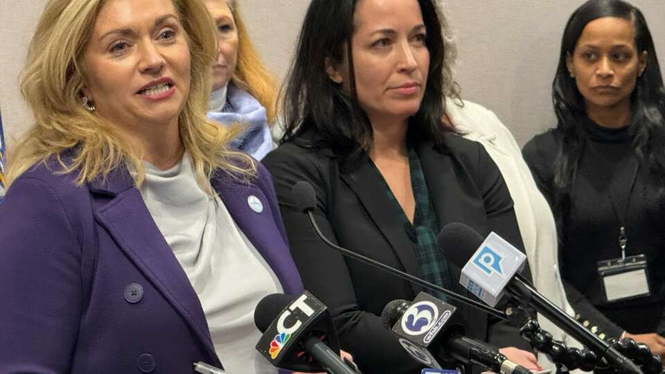 Rep. Eleni Kavros DeGraw, D-Avon, left, with Sarah Fox, CEO of the Connecticut Coalition to End Homeless, during a Friday news conference in the State Capitol complex.