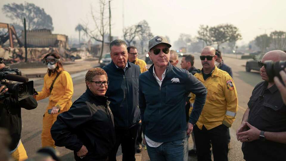 California Governor Gavin Newsom and Los Angeles Mayor Karen Bass tour the downtown business district of Pacific Palisades as the Palisades Fire continues to burn on Jan. 8, 2025, in Los Angeles. Fueled by intense Santa Ana Winds, the Palisades Fire has grown to over 2,900 acres and 30,000 people have been ordered to evacuate while a second major fire continues to burn near Eaton Canyon in Altadena.