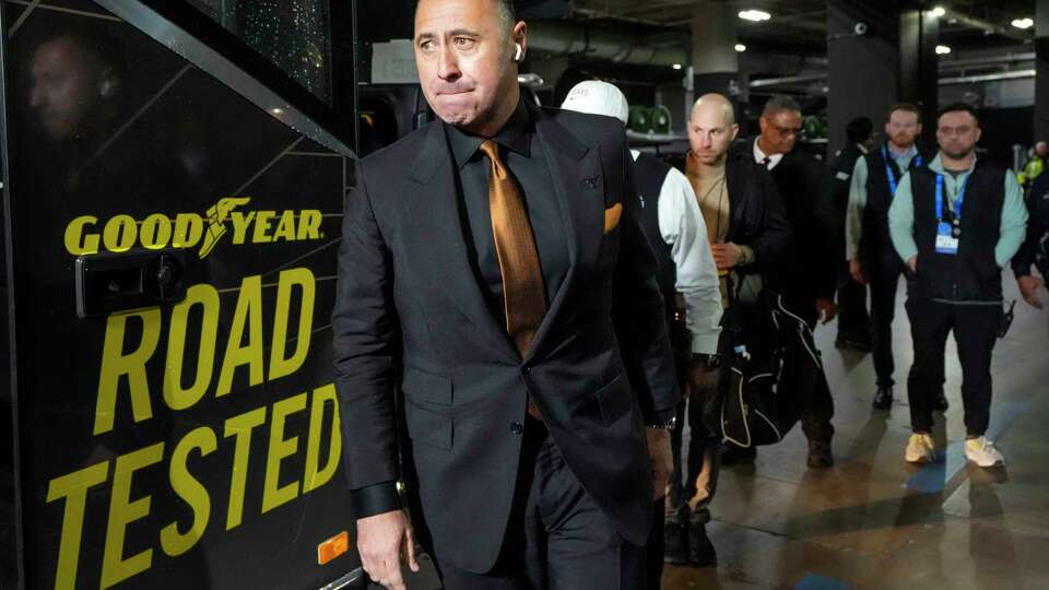 Texas head coach Steve Sarkisian walks off the team bus upon arrival at AT&T Stadium for a College Football Playoff semifinal game against Ohio State at the Goodyear Cotton Bowl, Friday, Jan. 10, 2025, in Arlington.