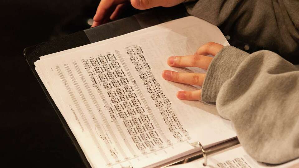 A performer reads music during a rehearsal of “Tomorrow’s Memories: A Little Manila Diary,” presented by The San Francisco Girls Chorus at the Magic Theater in San Francisco, Calif., on Saturday, June 10, 2023. The choral-opera was intended to debut last year, but was canceled due to COVID-19.