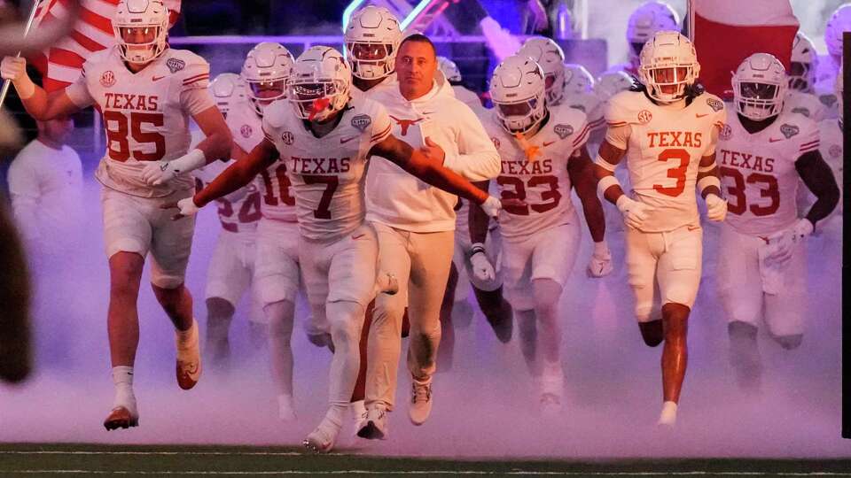 Texas takes the field before a College Football Playoff semifinal game at the Goodyear Cotton Bowl, Friday, Jan. 10, 2025, in Arlington.