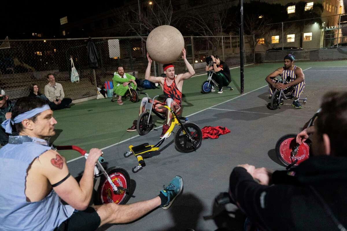 Glenn Black explains the rules of Sportsball to fellow players before a game at Jackson Playground Park in San Francisco on Thursday, Jan. 9, 2025.