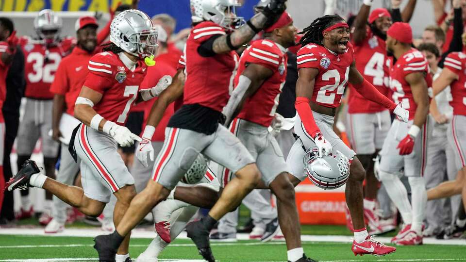 Ohio State cornerback Jermaine Mathews Jr. (24) celebrates after the Buckeyes intercepted a pass by Texas quarterback Quinn Ewers during the second half of a College Football Playoff semifinal game at the Goodyear Cotton Bowl, Friday, Jan. 10, 2025, in Arlington.