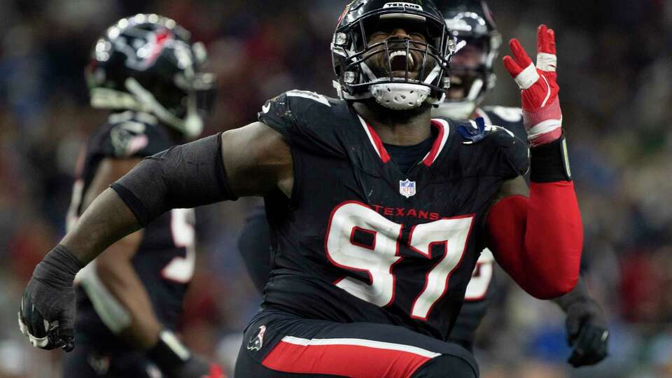 Houston Texans defensive tackle Mario Edwards Jr. (97) reacts after sacking Los Angeles Chargers quarterback Justin Herbert during the second half of an AFC Wild Card playoff football game, Saturday, Jan. 11, 2025, in Houston.