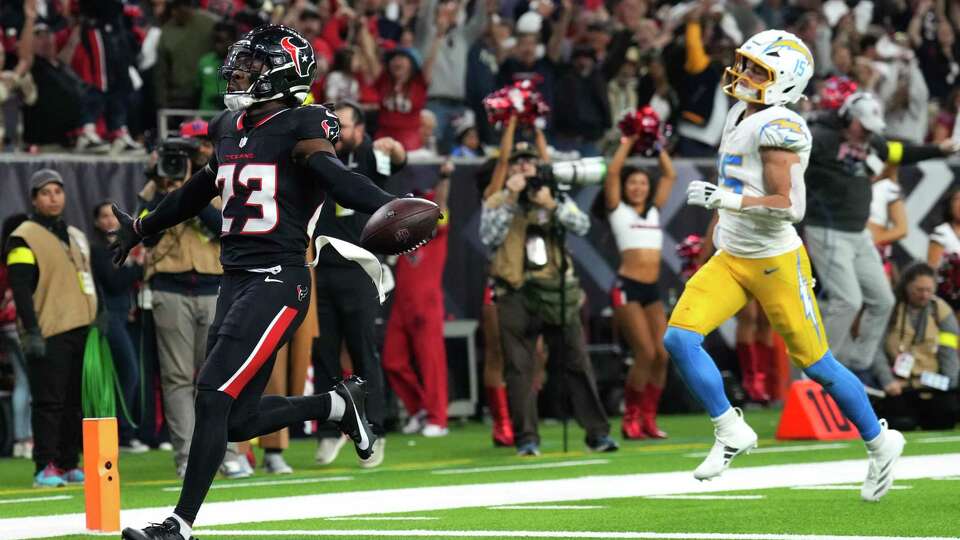 Houston Texans safety Eric Murray (23) reacts after returning an intercepting against Los Angeles Chargers quarterback Justin Herbert for a 38-yard touchdown during the second half of an AFC Wild Card playoff football game, Saturday, Jan. 11, 2025, in Houston.