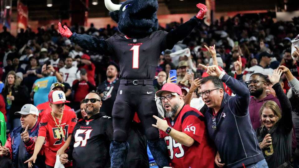 Houston Texans mascot Toro celebrates with the fans during the second half of an AFC Wild Card football game against the Los Angeles Chargers, Saturday, Jan. 11, 2025, in Houston.