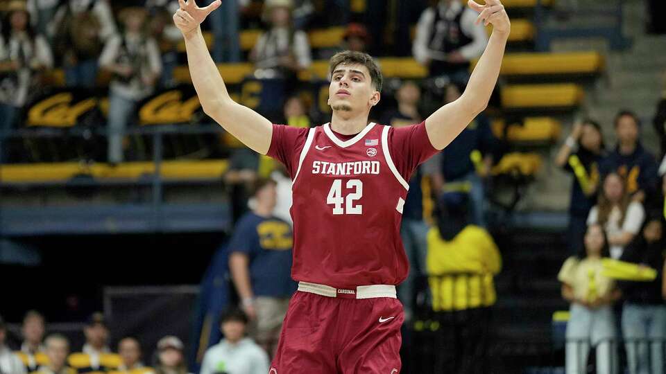 BERKELEY, CALIFORNIA - DECEMBER 07: Maxime Raynaud #42 of the Stanford Cardinal reacts after making a three-point shot against the California Golden Bears during the first half at Haas Pavilion on December 07, 2024 in Berkeley, California.