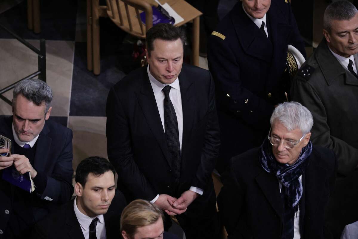 Tesla and SpaceX CEO Elon Musk arrives inside Notre-Dame Cathedral ahead of a ceremony to mark the re-opening of the landmark cathedral, in central, Paris on December 7, 2024.