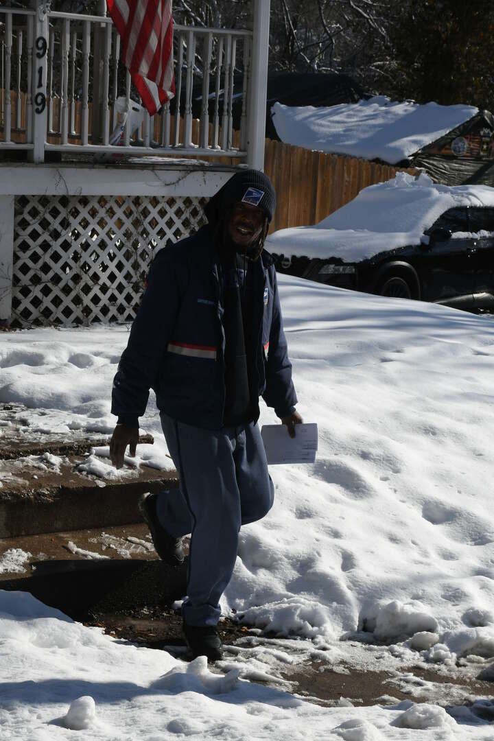 Alton residents tackle heavy snowfall; some dream of warmer climates