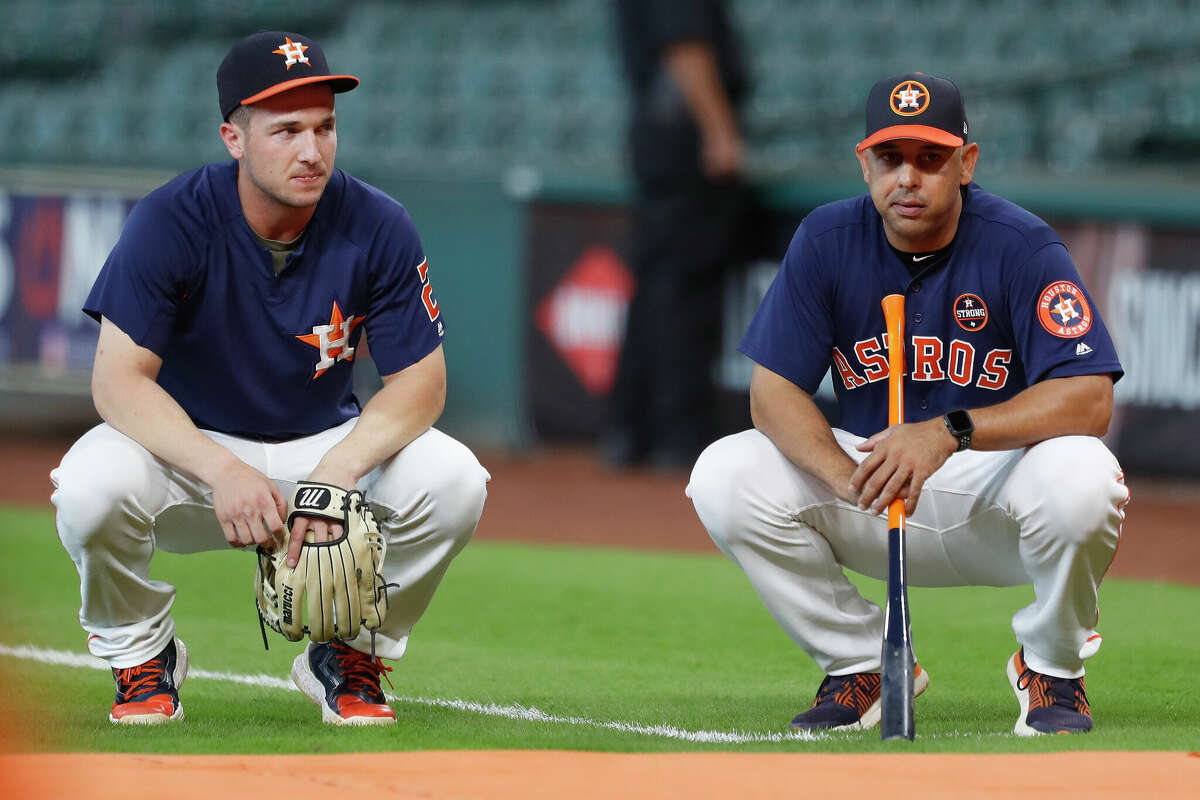 Houston Astros bench coach Alex Cora (26) with Alex Bregman (2) during batting practice before an MLB baseball game at Minute Maid Park, Wednesday, Sept. 20, 2017, in Houston. 