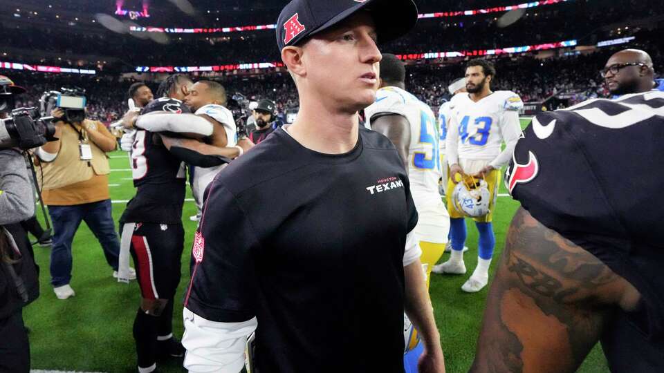 Houston Texans offensive coordinator Bobby Slowik walks on the field after the Texans 32-12 win over the Los Angeles Chargers in an AFC Wild Card playoff football game, Saturday, Jan. 11, 2025, in Houston.