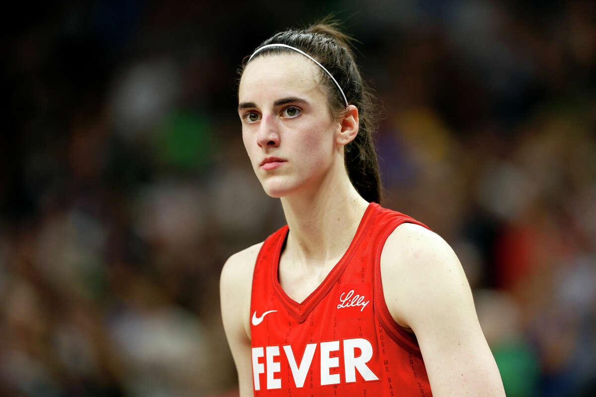 MINNEAPOLIS, MINNESOTA - JULY 14: Caitlin Clark #22 of the Indiana Fever looks on against the Minnesota Lynx in the fourth quarter at Target Center on July 14, 2024 in Minneapolis, Minnesota. The Fever defeated the Lynx 81-74. NOTE TO USER: User expressly acknowledges and agrees that, by downloading and or using this photograph, User is consenting to the terms and conditions of the Getty Images License Agreement. (Photo by David Berding/Getty Images)