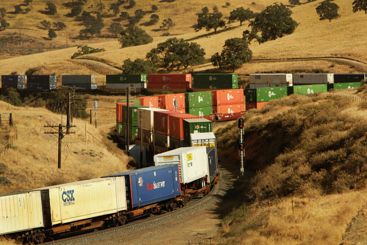 A freight train slowly climbs eastbound heading into Tehachapi Pass in Kern County, California.