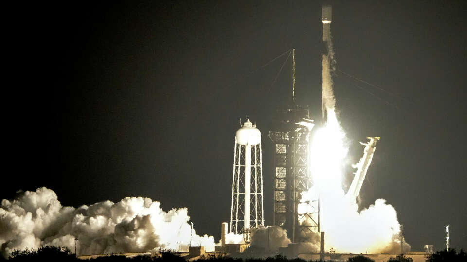 A SpaceX Falcon 9 rocket lifts off from pad 39A with a pair of lunar landers at the NASA Kennedy Space Center in Cape Canaveral, Fla., Wednesday, Jan. 15, 2025. (AP Photo/John Raoux)