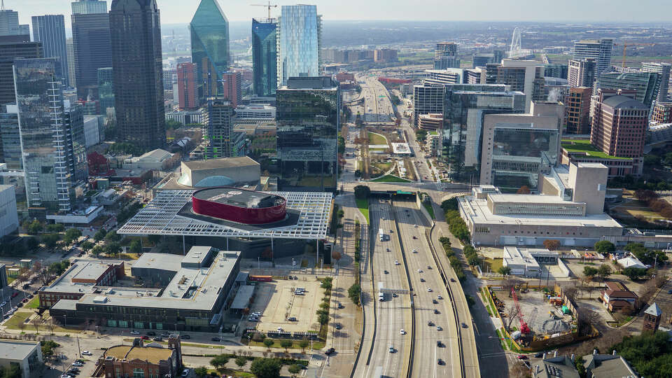 Aerial view the arts district, including Booker T. Washington High School (bottom left) the AT&T Performance Center (middle left) Woodall Rodgers Freeway, (Texas 366, center) and Klyde Warren Park with downtown at left and uptown at right on Sunday, Jan. 12, 2020, in Dallas. (Smiley N. Pool/The Dallas Morning News)