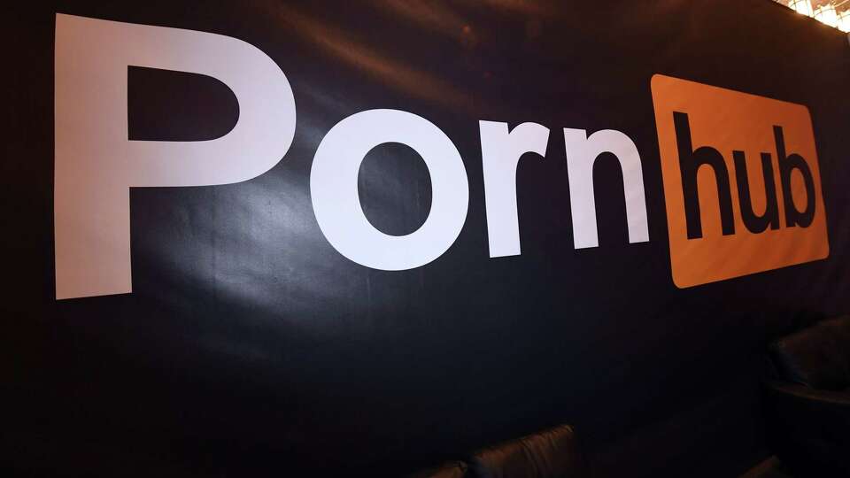 A Pornhub logo is displayed at the company's booth at the AVN Adult Entertainment Expo at the Hard Rock Hotel & Casino on Jan. 24, 2018, in Las Vegas.