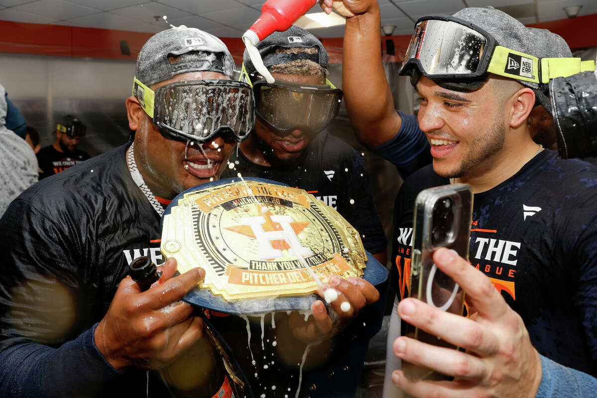 The Houston Astros celebrate in the locker room after winning the AL West Division by defeating the Seattle Mariners at Minute Maid Park on September 24, 2024 in Houston, Texas.