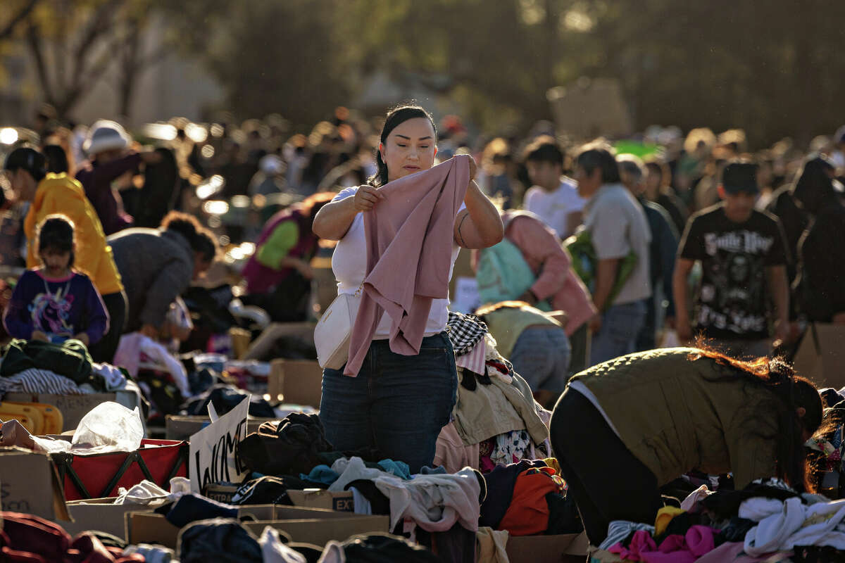 Community members stop by a donation center that has taken over the parking lot at the Santa Anita Racetrack to gather much needed food, water, clothes and supplies after the Eton fire in Altadena on Monday, Jan. 13, 2025 in Arcadia, CA. 