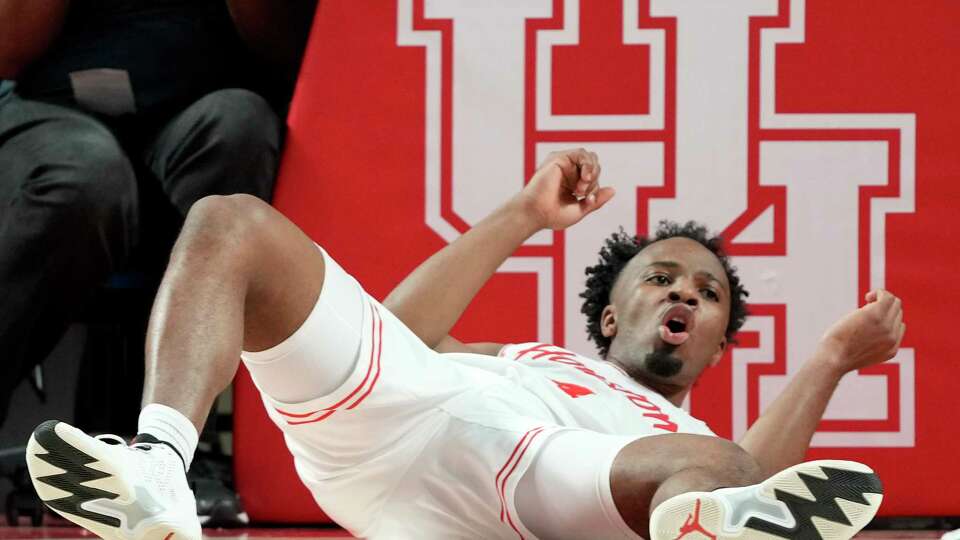 Houston guard L.J. Cryer (4) reacts after being called for a block during the first half of a Big 12 Conference NCAA basketball game, Wednesday, Jan. 15, 2025, in Houston.