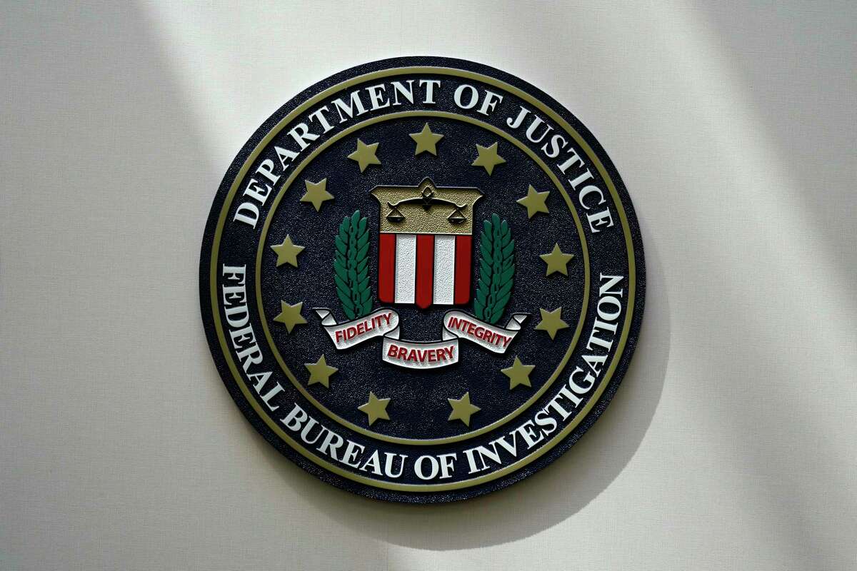 FILE - The FBI seal is pictured in Omaha, Neb., Aug. 10, 2022. FBI officials repeatedly violated their own standards when they searched a vast repository of foreign intelligence for information related to the insurrection at the U.S. Capitol on Jan. 6, 2021, and racial justice protests in 2020. That's according to a heavily blacked-out court order released Friday, May 19, 2023. FBI officials said the violations predated a series of corrective measures that started in the summer of 2021 and continued last year. (AP Photo/Charlie Neibergall, File)