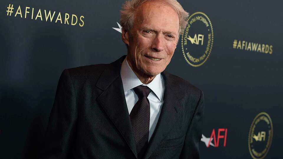 FILE - Clint Eastwood arrives at the AFI Awards on Jan. 3, 2020, in Los Angeles. An iconic western starring Eastwood has been dubbed in the Navajo language. The movie, “A Fistful of Dollars,” or “Béeso Dah Yiníljaa’” in Navajo, will be screened this month on or near the reservation that extends into Arizona, New Mexico and Utah. A premiere for the cast and crew is scheduled Nov. 16, 2021, at the Window Rock, Ariz., theater. The Western is the third major film available in the Navajo language. (Photo by Jordan Strauss/Invision/AP, File)