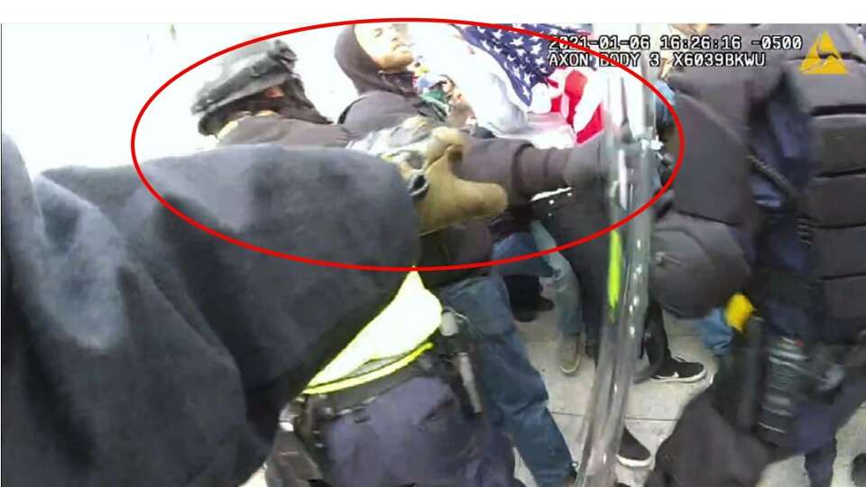 A still image taken from police body-worn cameras during the Jan. 6 insurrection that allegedly shows Frank Peter Molinari Giorgi Jr. pushing officers. Giorgi Jr. was arrested and charged for his alleged attacks on officers during the siege of the U.S. Capitol. 