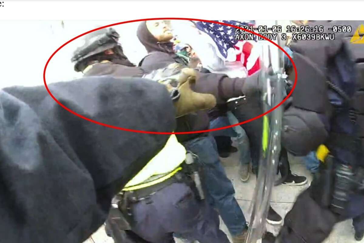 A still image taken from police body-worn cameras during the Jan. 6 insurrection that allegedly shows Frank Peter Molinari Giorgi Jr. pushing officers. Giorgi Jr. was arrested and charged for his alleged attacks on officers during the siege of the U.S. Capitol. 