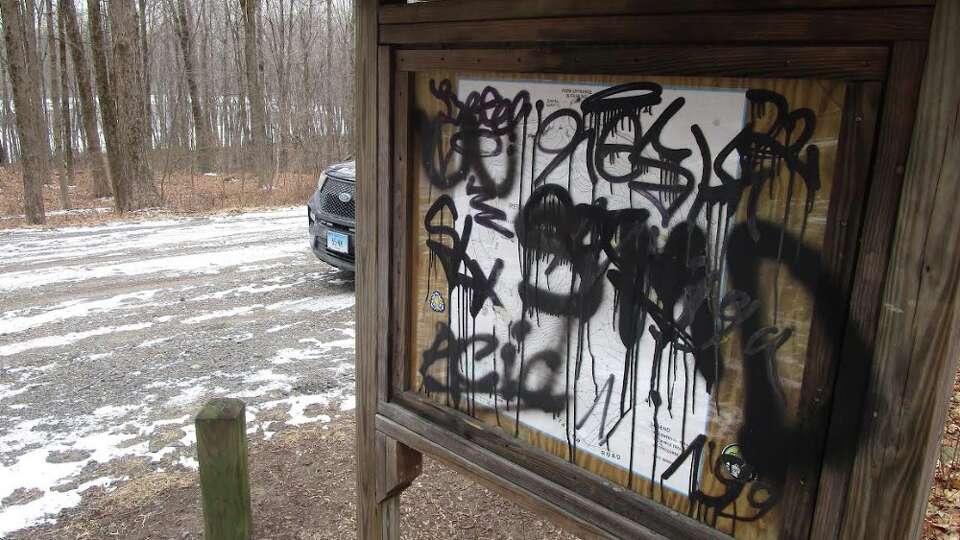 New Milford police are investigating the vandalism of the sign at the western park entrance at Reservoir Park.