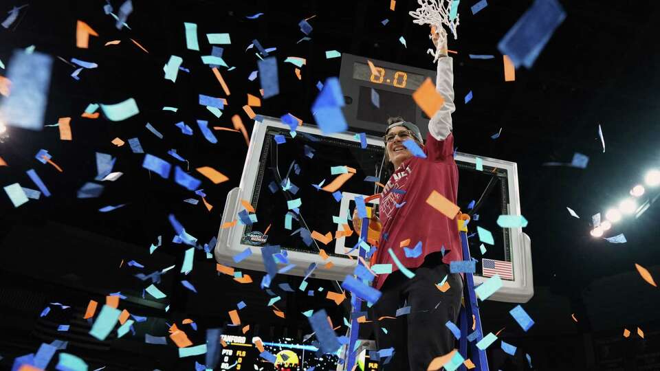 SPOKANE, WA - MARCH 27: Head coach Tara VanDerveer of the Stanford Cardinal celebrates cutting down the nets after beating the Texas Longhorns 59-50 during the Elite 8 round of the 2022 NCAA Womens Basketball Tournament held at Spokane Veterans Memorial Arena on March 27, 2022 in Spokane, Washington.