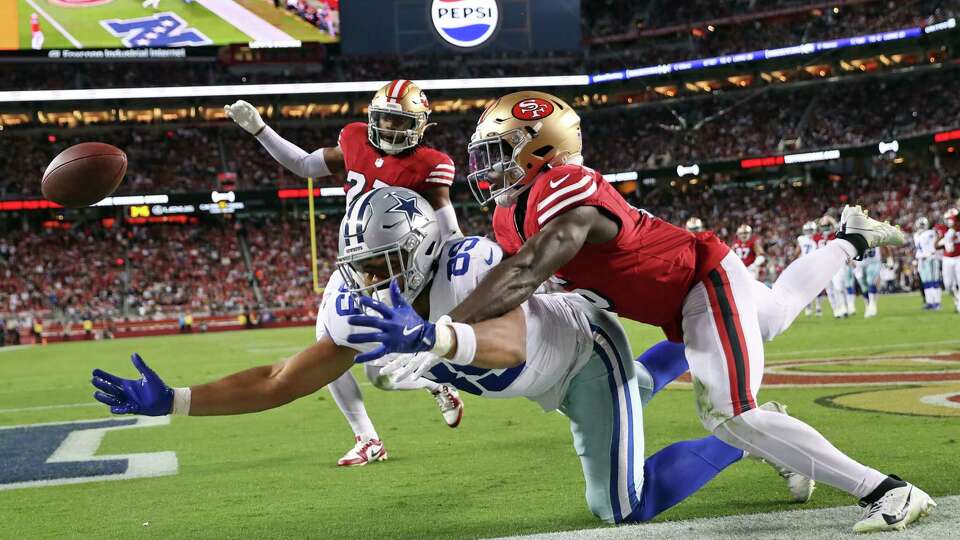 Dallas Cowboys’ Brevyn Spann-Ford can’t catch a pass in the end zone against San Francisco 49ers’ Malik Mustapha in 2nd quarter during NFL game at Levi’s Stadium in Santa Clara, Calif., on Sunday, October 27, 2024.