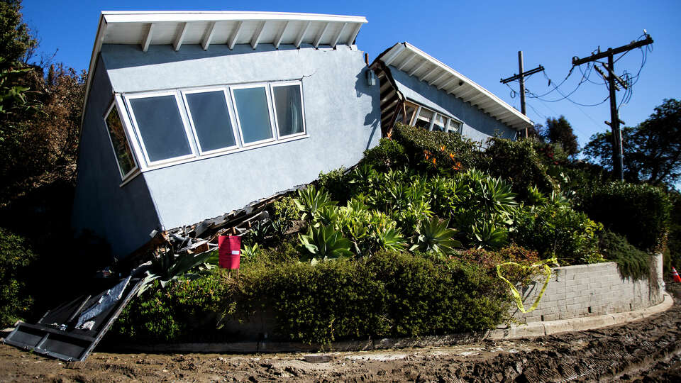 A split home due to a landslide following a wildfire in Pacific Palisades, Calif., on Thursday, January 16, 2025.