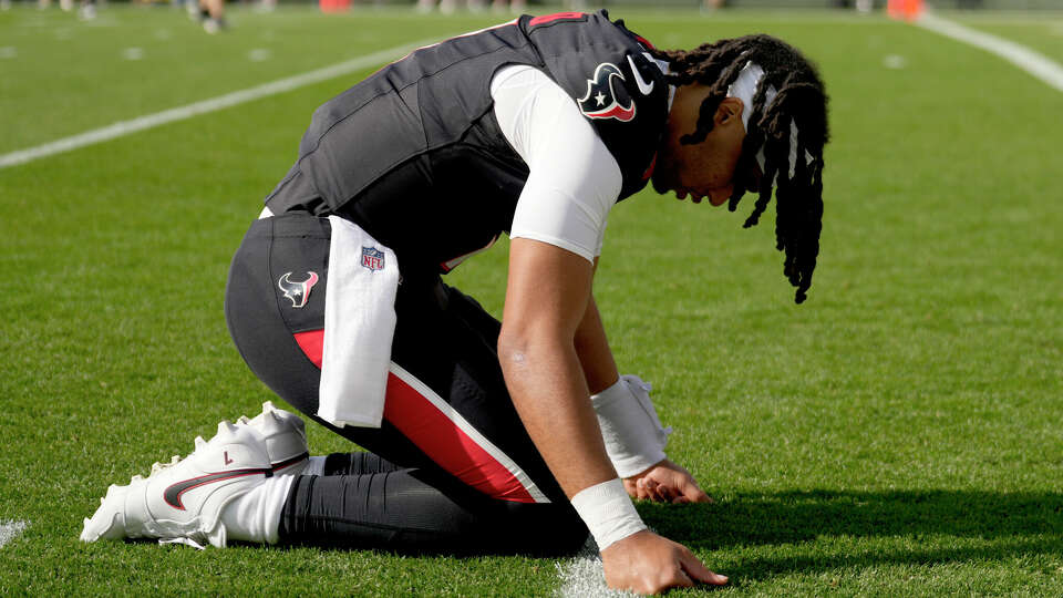 Houston Texans quarterback C.J. Stroud (7) prays before an NFL football game Sunday, Oct. 20, 2024, in Green Bay, Wis.