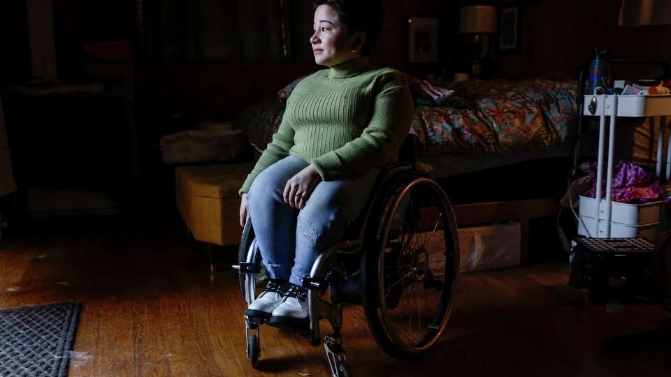 Rosemary McDonnell-Horita poses for a portrait at her home in Berkeley on Sunday, Dec. 15, 2024. McDonnell-Horita was forced to crowdfund a new wheelchair after her insurance wouldn’t cover the same chair that she has been using for 10 years.