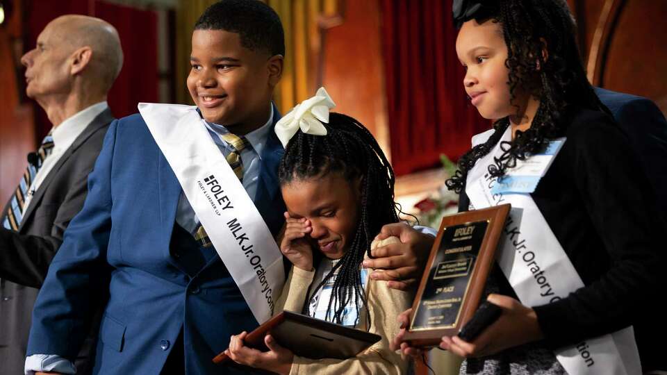 Winners Rashaud Williams, Montoia Murray and Jae’Lauryn Brown pose for a photo after placing in the 2025 Foley MLK Jr. Oratory Competition on Friday, Jan. 17, 2025, at Antioch Missionary Baptist Church of Christ in Houston.