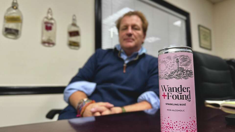 Chris Becker sits in an office at the Better Rhodes/BevMax Stamford distribution center.