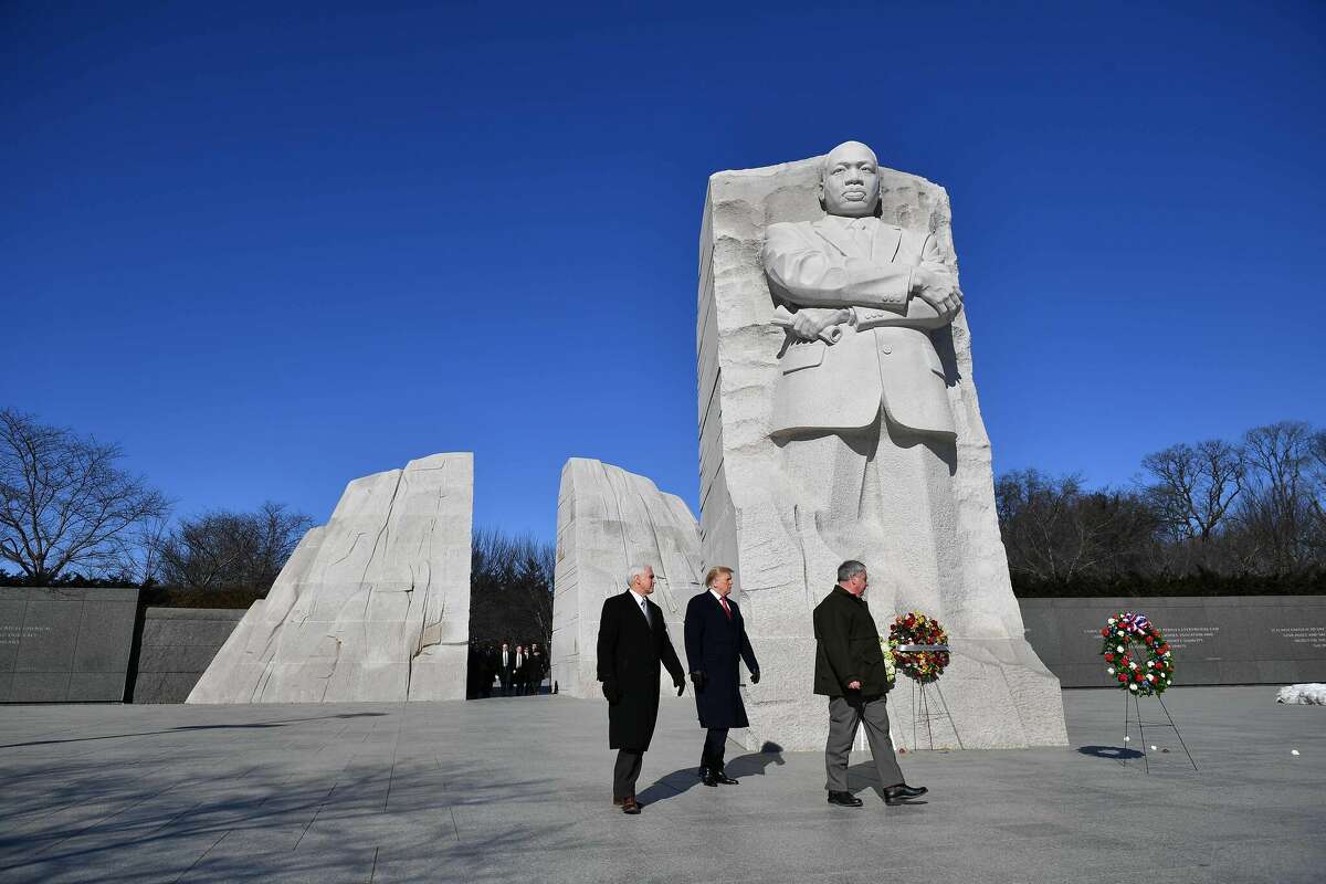 President Donald Trump, center, visits the Martin Luther King Jr. Memorial in Washington, D.C., on Martin Luther King Jr. Day on Jan. 21, 2019. 