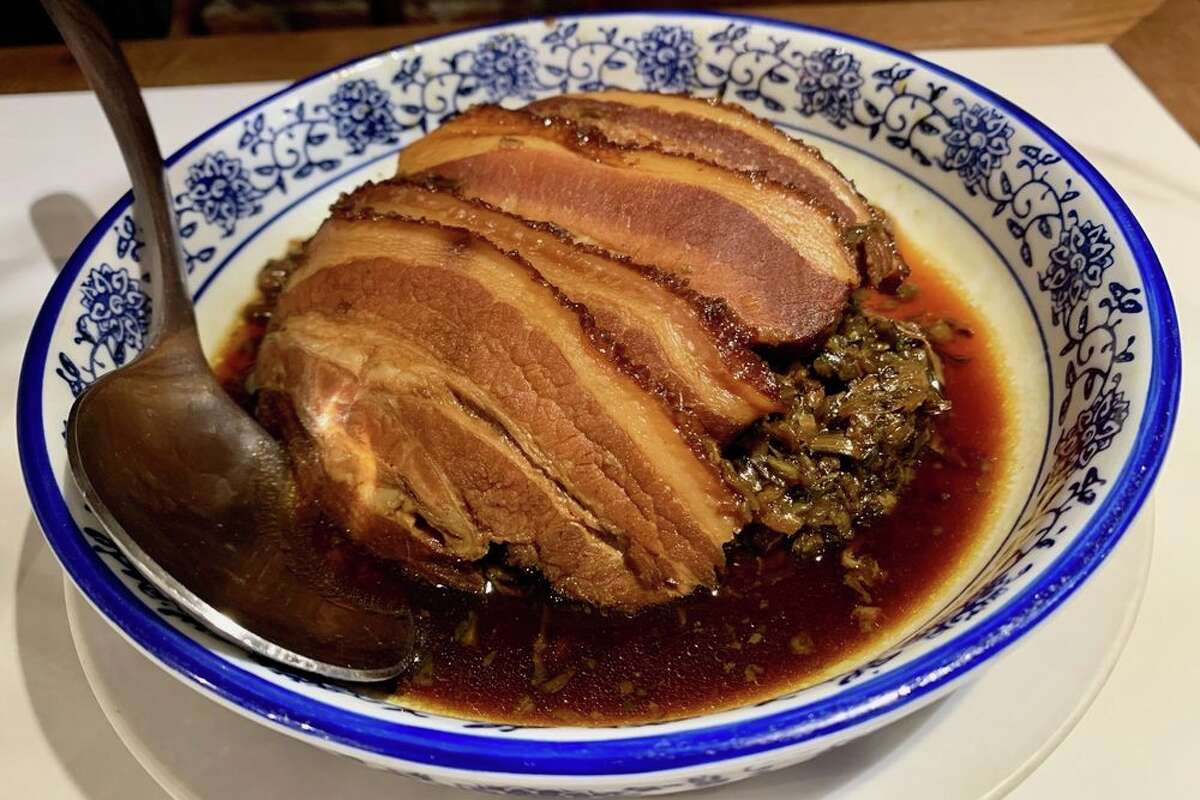 Braised pork belly slices with preserved vegetables at Z&Y Peking Duck in San Francisco, Calif.