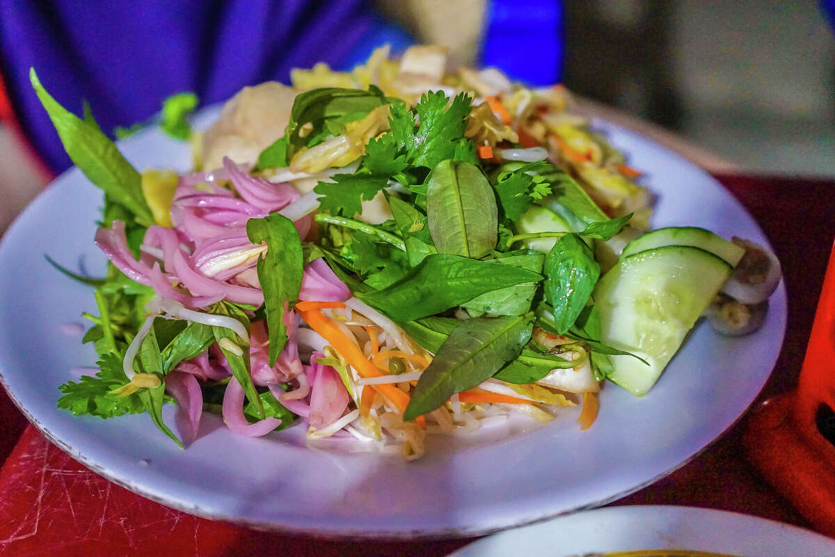 Com Ga, seen here, is a favorite street food in Vietnam. The dish of chicken and rice with vegetables is the star of the show at Com Ga Houston.