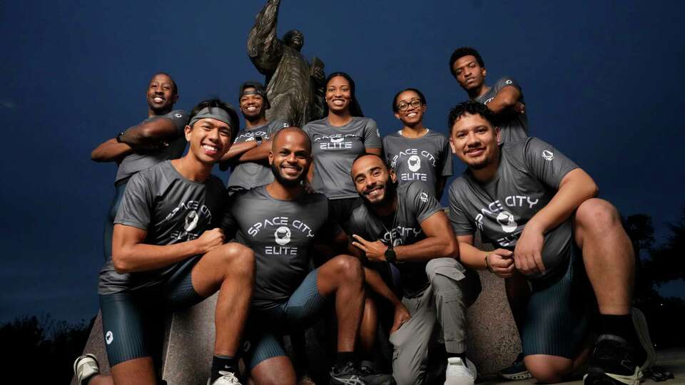 Runners of Space City Elite Running, a group of Black local runners, pose for a photograph with the MLK statue Friday, Jan. 17, 2025 at MacGregor Park in Houston. They formed the group for the express purpose of showing the local Black community that it can have a place in distance running. Front row from left: Rodel Allen Enderez, Salem Boyd, Brian Mishaw and Leo Sanchez Camacho. Back row from left: Derwin Graham, Ra’Shaude Kenney, Chloe Franklin, Sarah Grant and Caleb Devereaux.