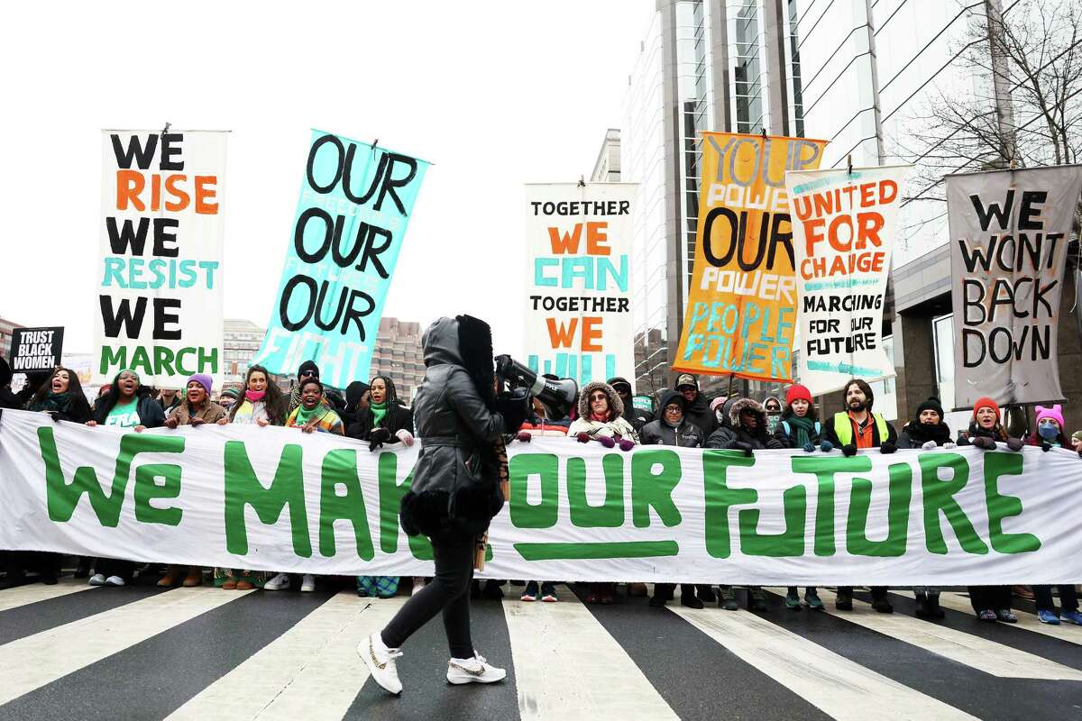 Protestors representing a variety of rights groups join the 'People's March on Washington' on January 18, 2025 in Washington, DC. Activists were rallying in opposition to the incoming Trump administration's policy objectives two days before the presidential inauguration.