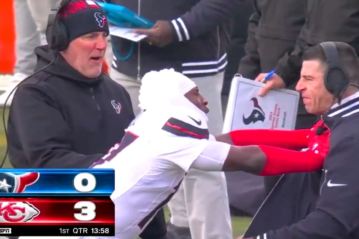 Houston Texans defensive back Kris Boyd shoves special teams coach Frank Ross after a first-quarter blunder against the Kansas City Chiefs